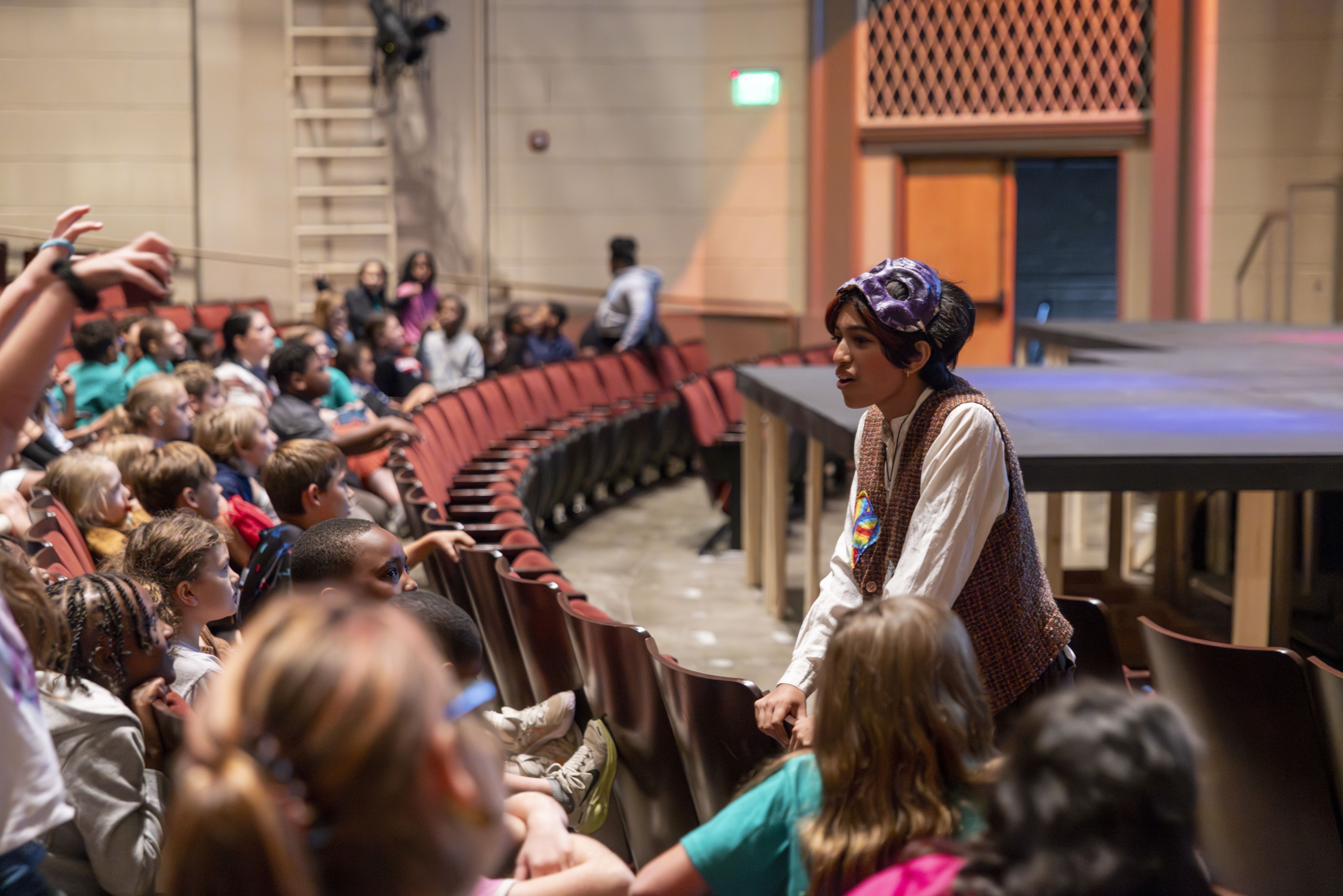 UGA theatre student Maya Shrivastav speaks to elementary school students on an Experience UGA trip.