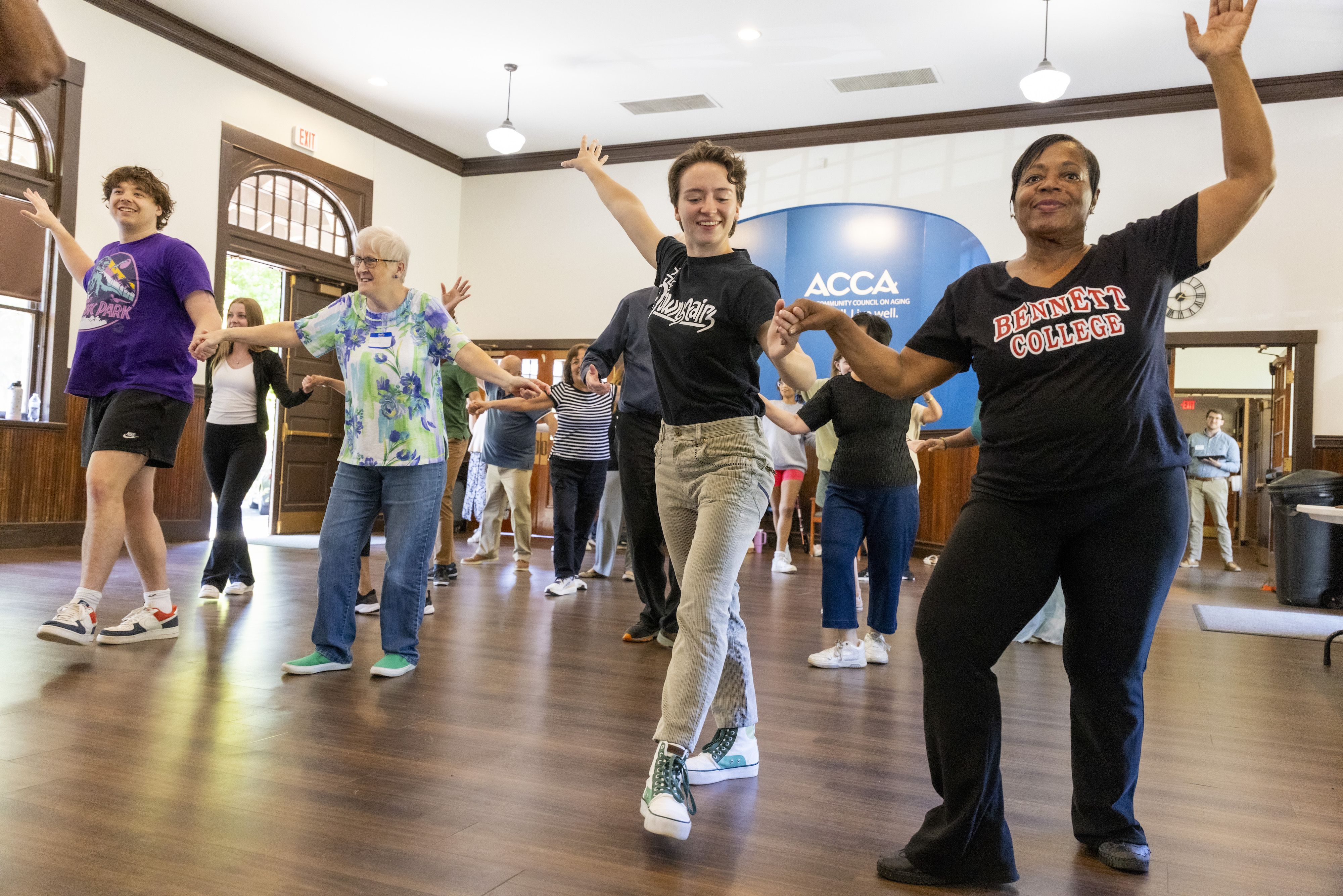 UGA students and seniors from the community dance during a class at the Athens Community Council on Aging