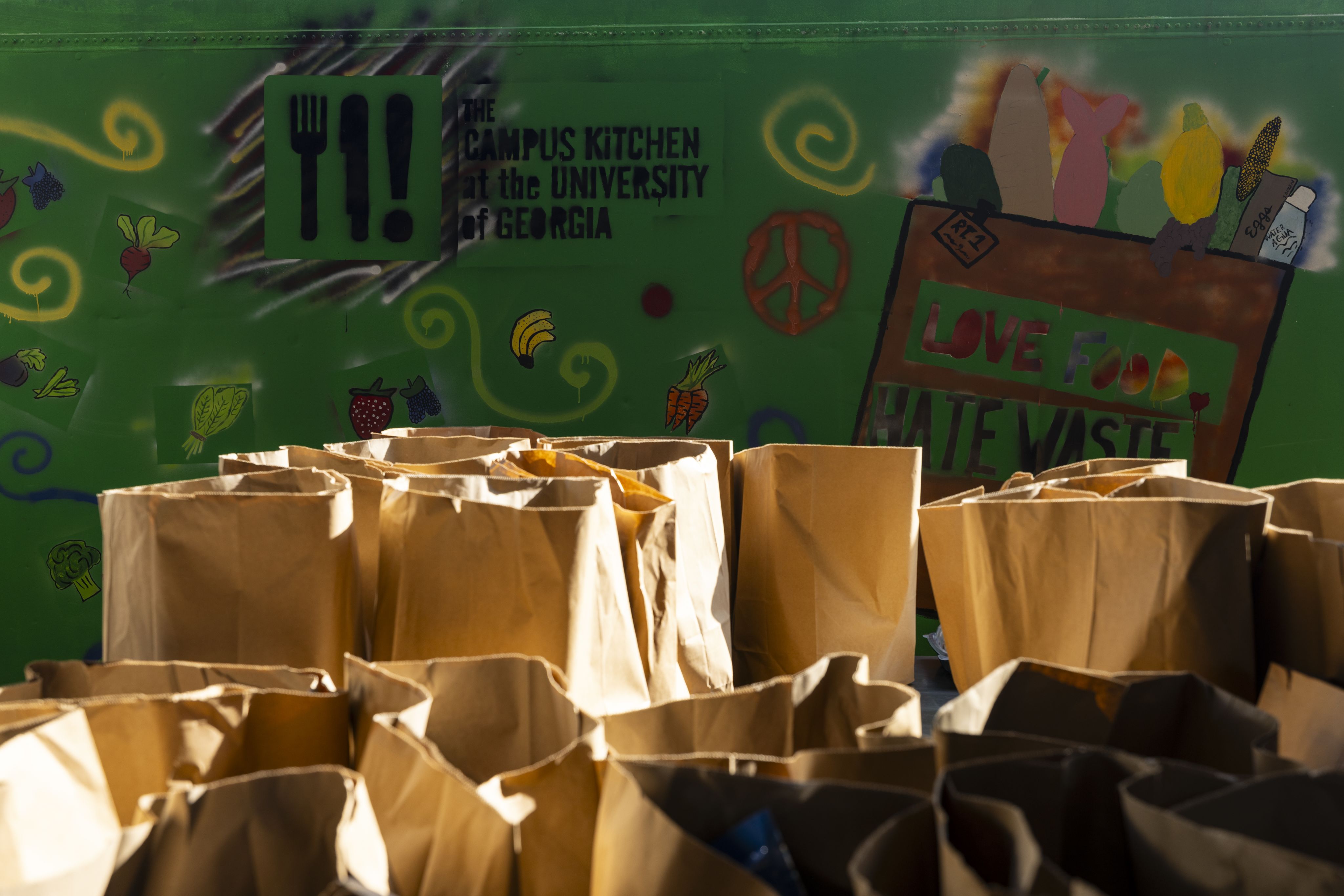 A series of paper grocery bags to be delivered to Campus Kitchen clients in the community