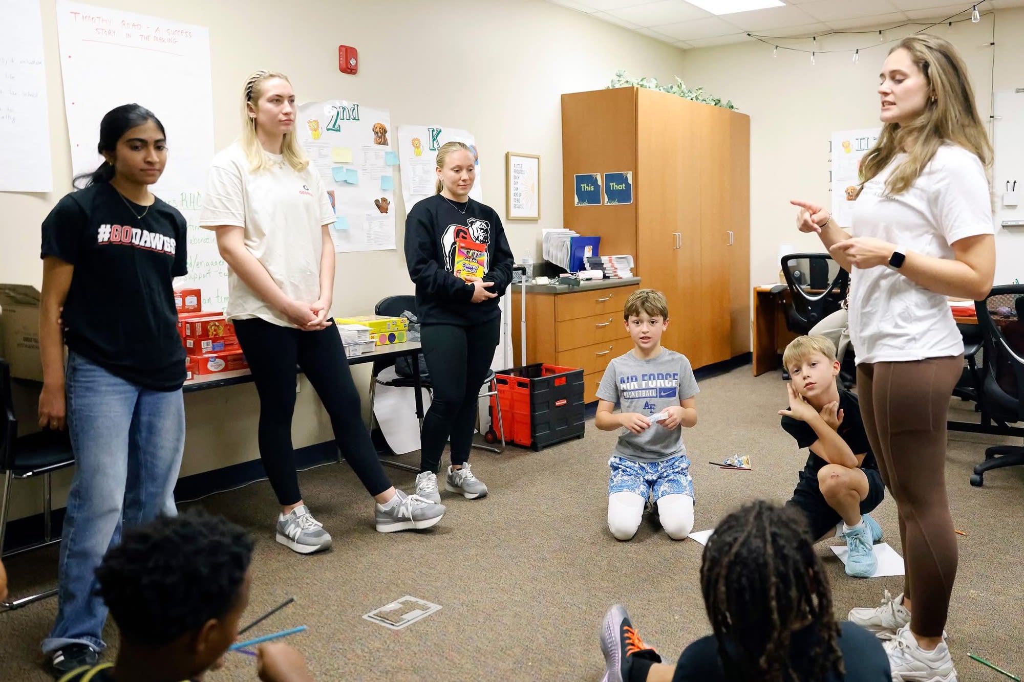 Coaching4Success mentors and CCSD students participate in an activity in the classroom