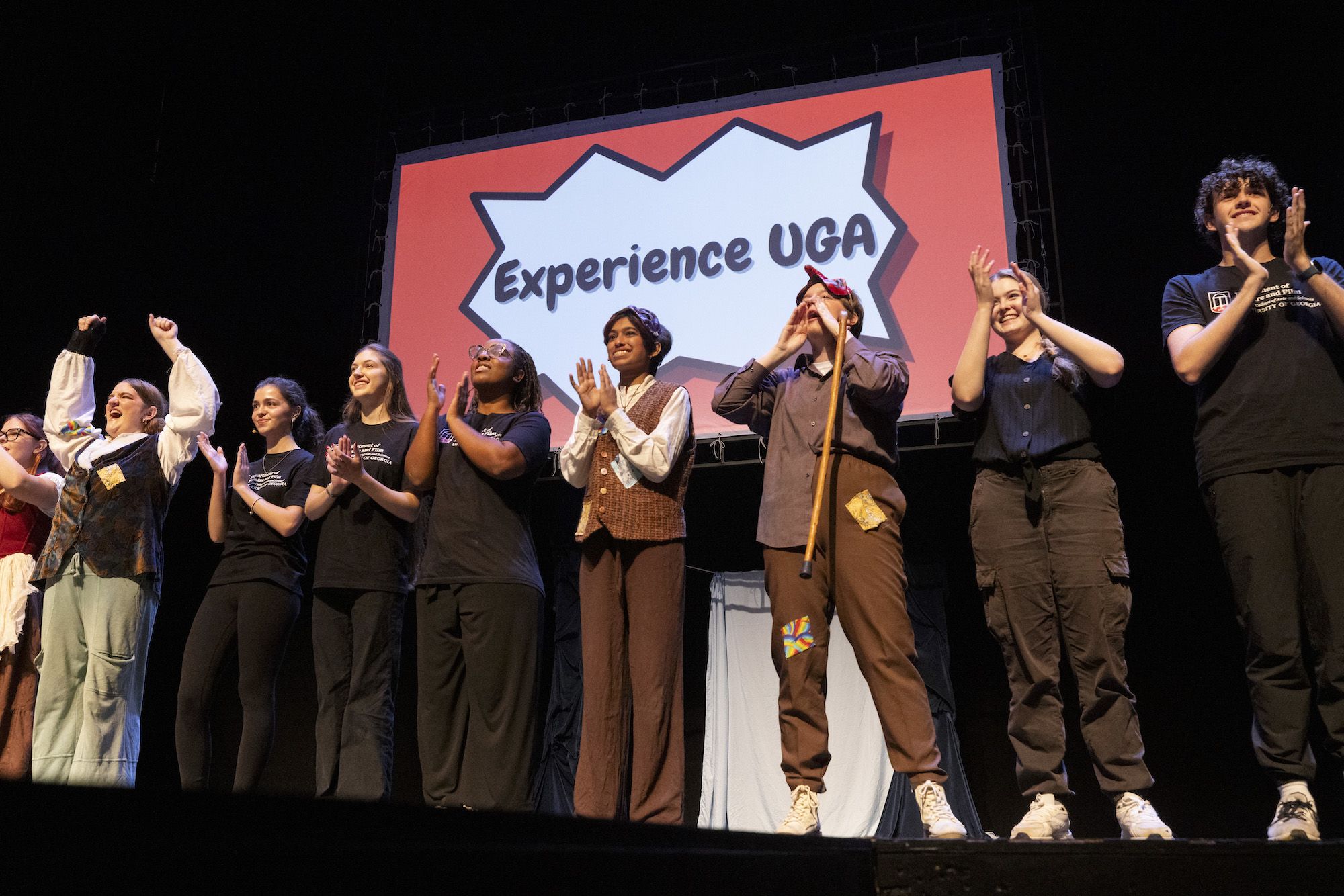 UGA theatre students clap on stage at the end of an Experience UGA performance 