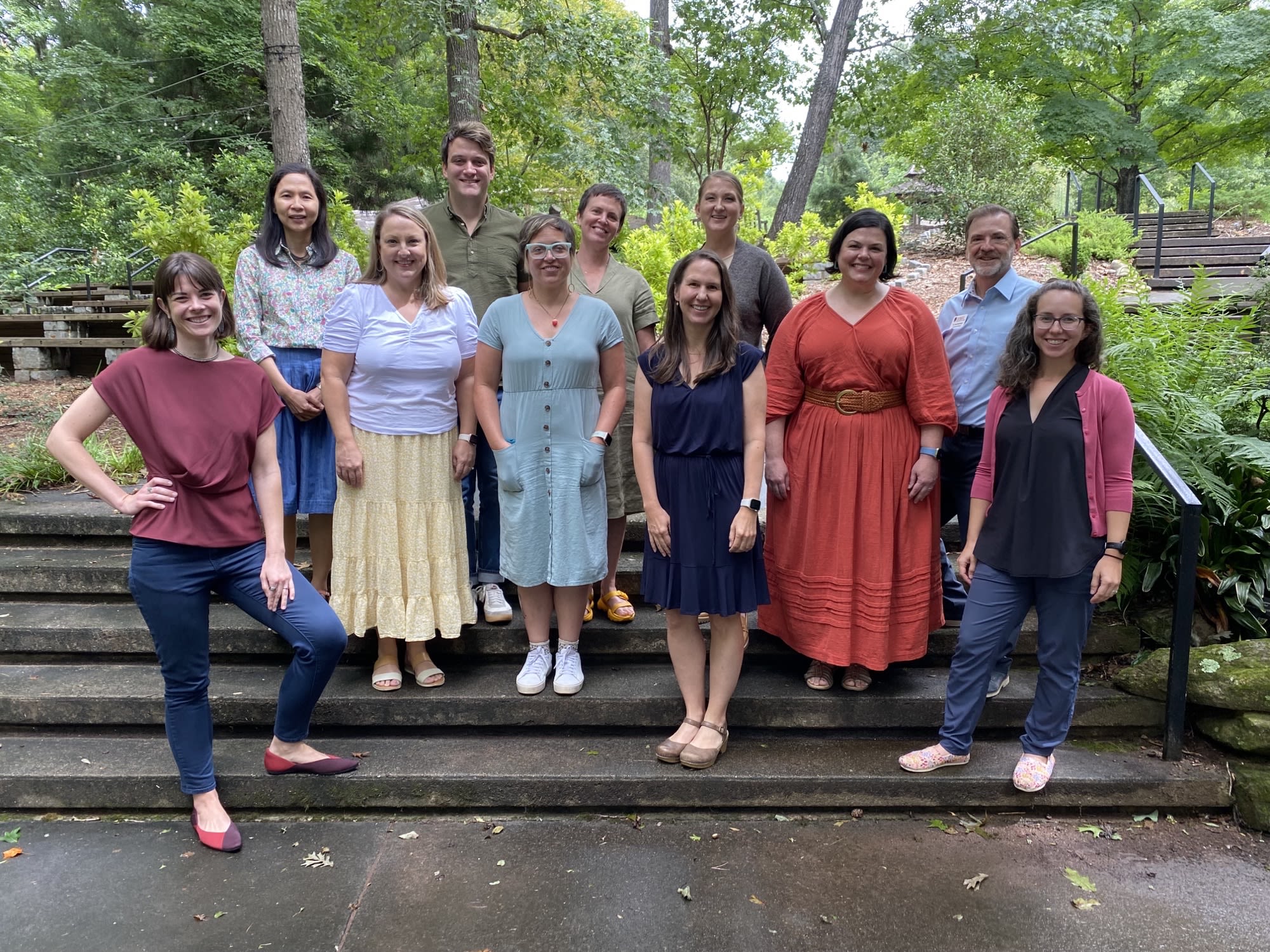 The 2023-24 cohort of Service-Learning Fellows pose for a photo with Paul Matthews.