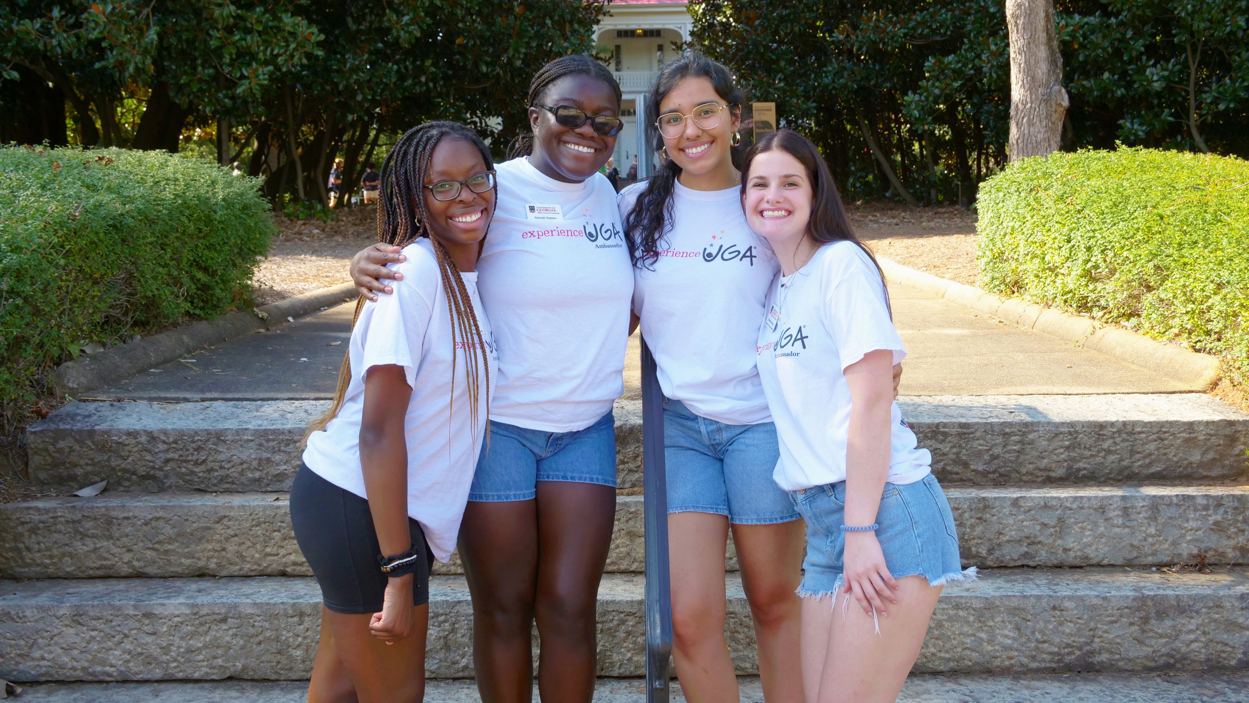 Four Experience UGA ambassadors pose for a photo.